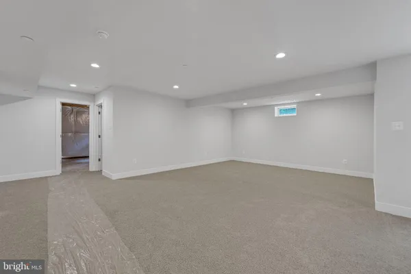 a bathroom with a double vanity sink mirror and a shower