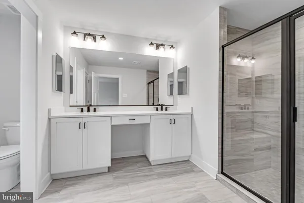 a view of a lush green forest with lots of trees