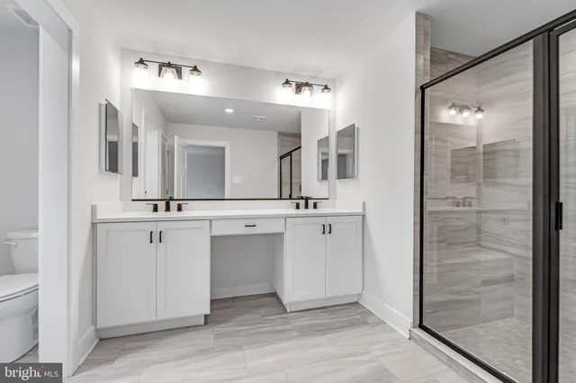 a view of a lush green forest with lots of trees