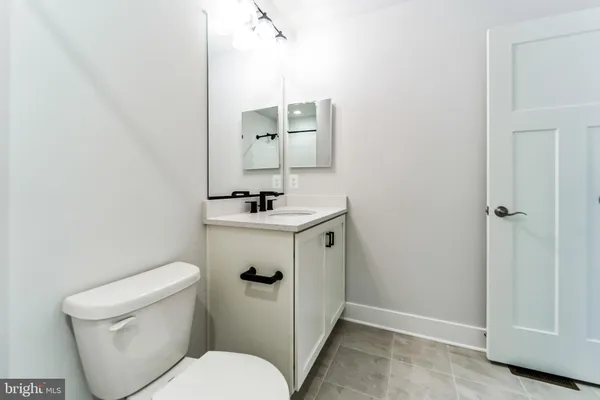 a backyard of a house with lots of green space and a fountain