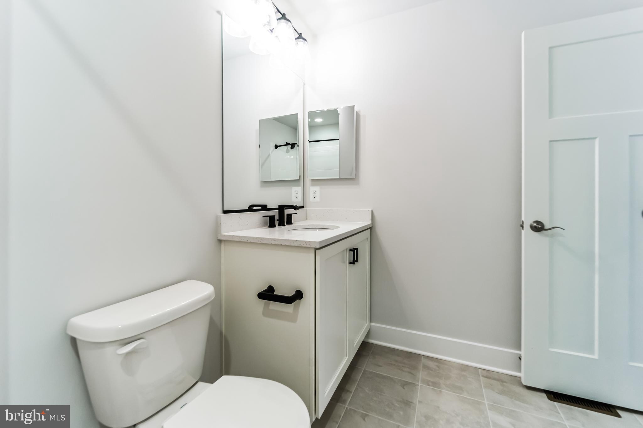 2229 A Ady Road Forest Hill, MD 21050 - Photo 48 of 75 a bathroom with a sink a toilet and mirror