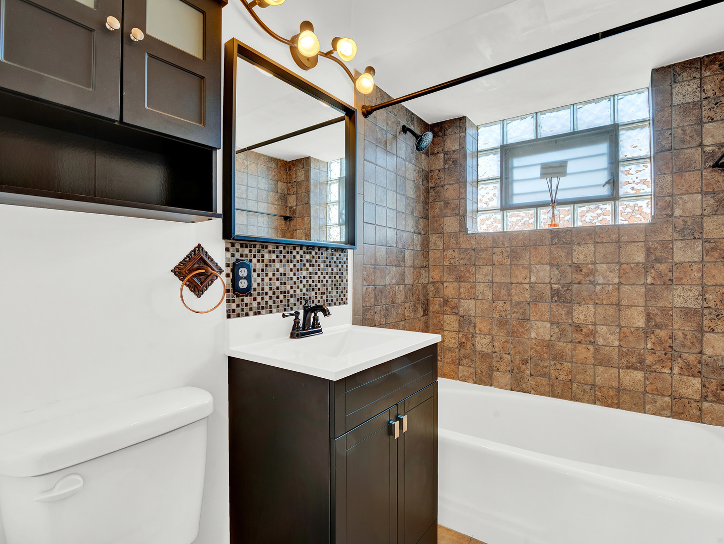 8000 South Pulaski Road, Unit 201 Chicago, IL 60652 - Photo 12 of 17 a bathroom with a sink a bathtub and a shower