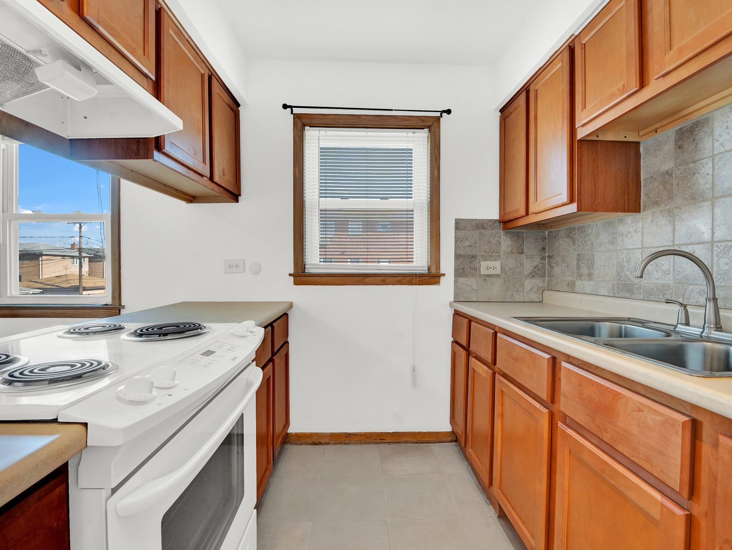 8000 South Pulaski Road, Unit 201 Chicago, IL 60652 - Photo 8 of 17 a kitchen with stainless steel appliances granite countertop a sink stove and cabinets