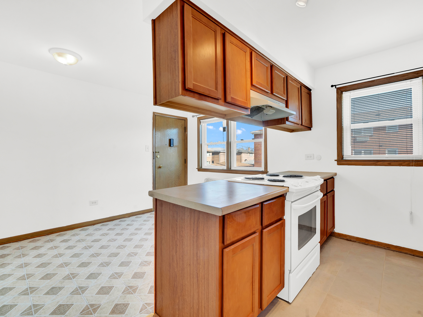 8000 South Pulaski Road, Unit 201 Chicago, IL 60652 - Photo 10 of 17 a kitchen with stainless steel appliances granite countertop a stove and a sink