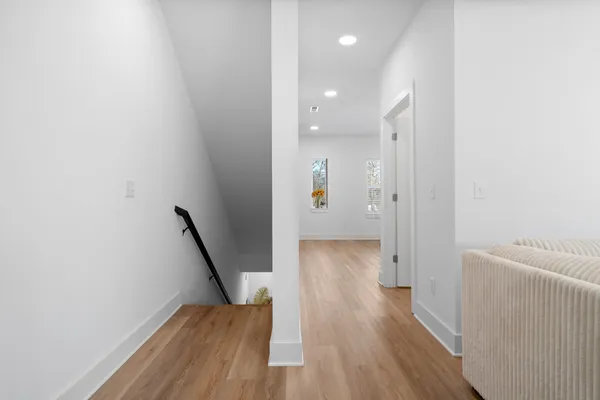 wooden floor in a hall with an entryway