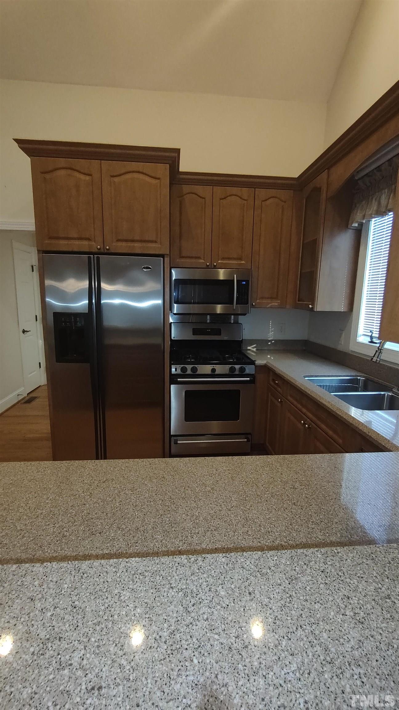 5445 Red Hill Church Road Coats, NC 27521 - Photo 8 of 66 Stainless Steel Appliances are true to home age. But all are functional. Gas Stove, Side by Side Refrigerator, and dishwasher are all in good working condition.