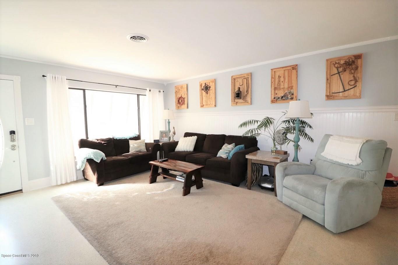 117 Chipola Road Cocoa Beach, FL 32931 - Photo 11 of 54 117 Chipola living room3