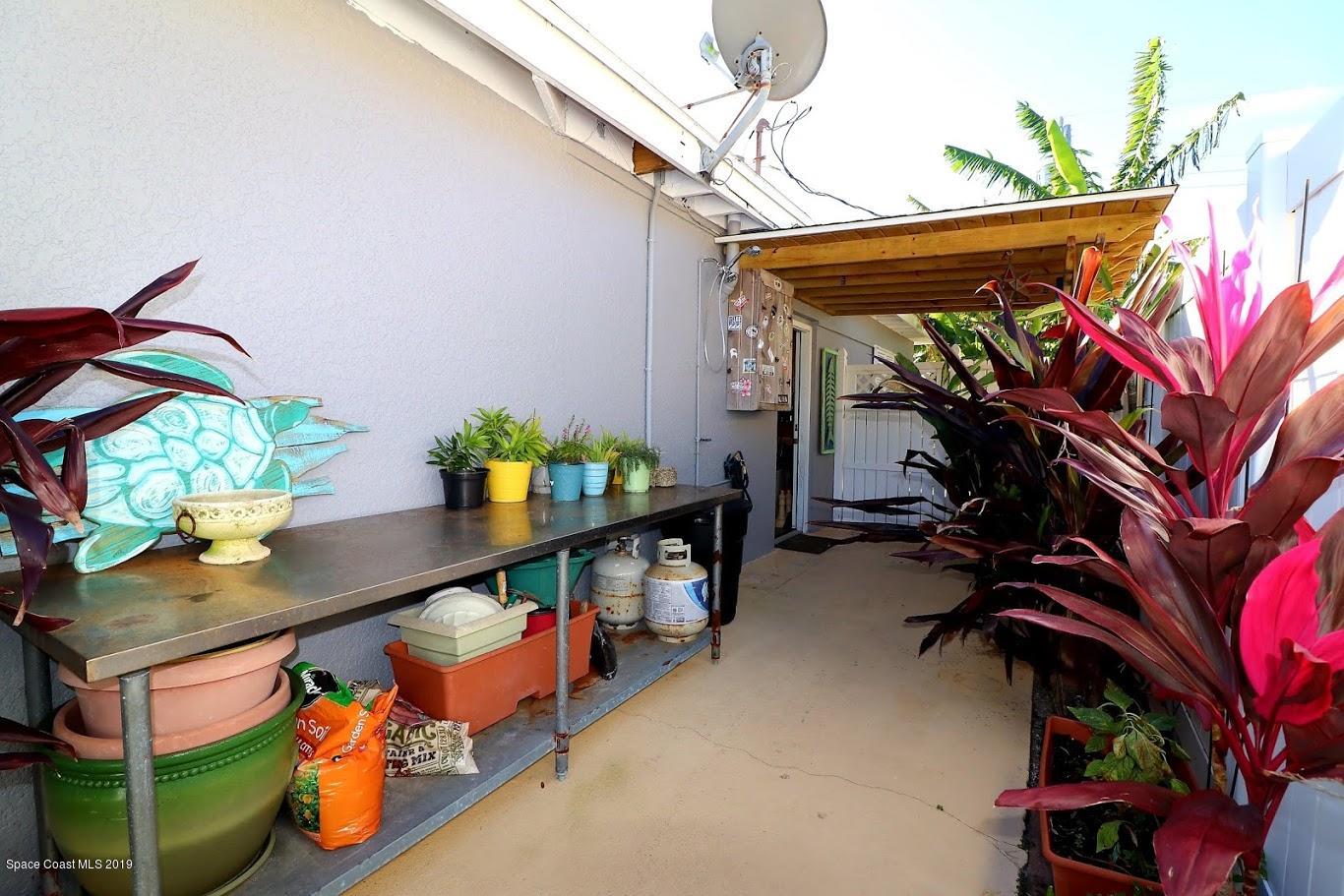 117 Chipola Road Cocoa Beach, FL 32931 - Photo 46 of 54 117 Chipola garden area2