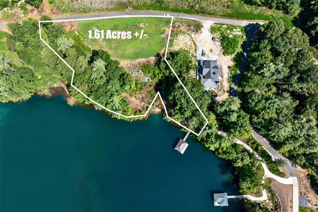 Building site parcel; septic parcel at .61 ac separate. Note:  Photographs showing approximate lot line locations are NOT intended to be representative of a survey.  Property lines depicted on aerial photographs may not be representative of actual property lines.