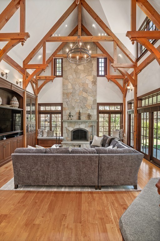 49 Possum Road Weston, MA 02493 - Photo 13 of 33 a living room with fireplace furniture and a chandelier