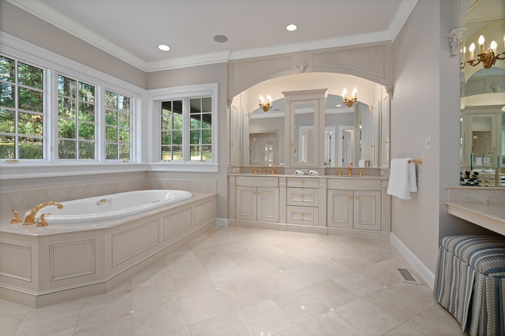 49 Possum Road Weston, MA 02493 - Photo 19 of 33 a spacious bathroom with a tub sink and mirror