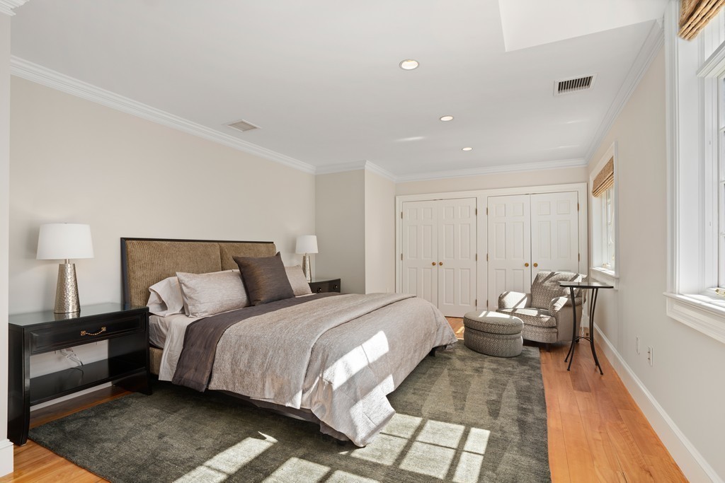 49 Possum Road Weston, MA 02493 - Photo 22 of 33 a bedroom with a bed and wooden floor