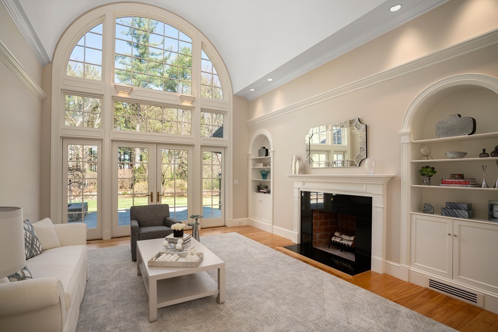 49 Possum Road Weston, MA 02493 - Photo 7 of 33 a living room with furniture a fireplace and a large window