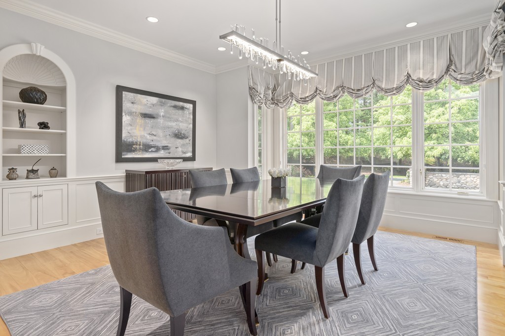 49 Possum Road Weston, MA 02493 - Photo 10 of 33 a dining room with furniture a chandelier and wooden floor