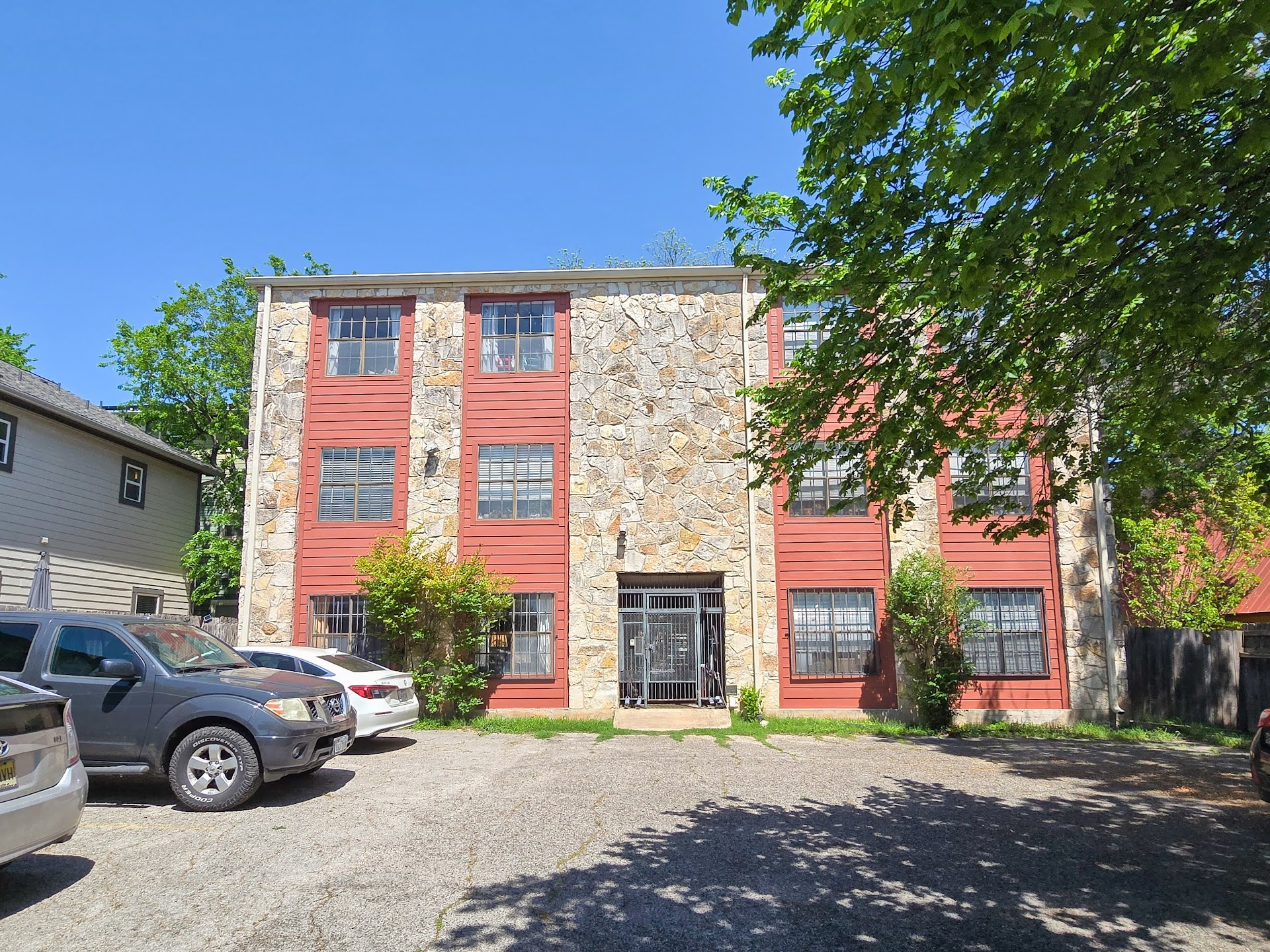 1903 East 20th Street, Unit 202 Austin, TX 78722 - Photo 8 of 8 View of building exterior featuring uncovered parking