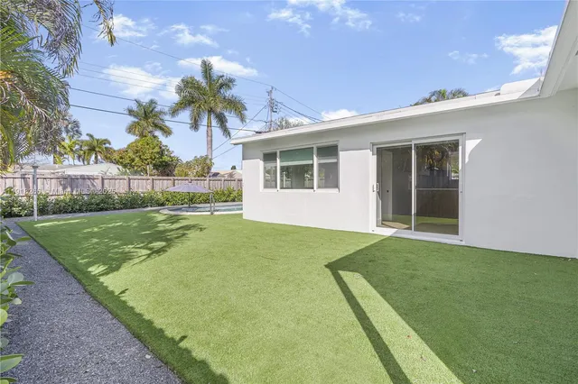 a view of a backyard with a garden and plants