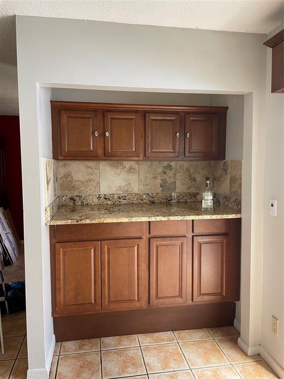 5871 Woodland Point Drive Tamarac, FL 33319 - Photo 2 of 10 a kitchen with granite countertop white cabinets and stainless steel appliances