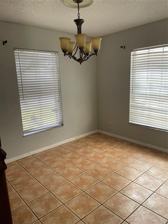 5871 Woodland Point Drive Tamarac, FL 33319 - Photo 4 of 10 a view of an empty room with a window