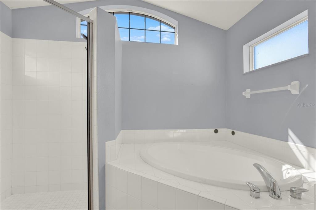 4400 Dior Road Spring Hill, FL 34609 - Photo 23 of 37 a white bath tub sitting in a bathroom