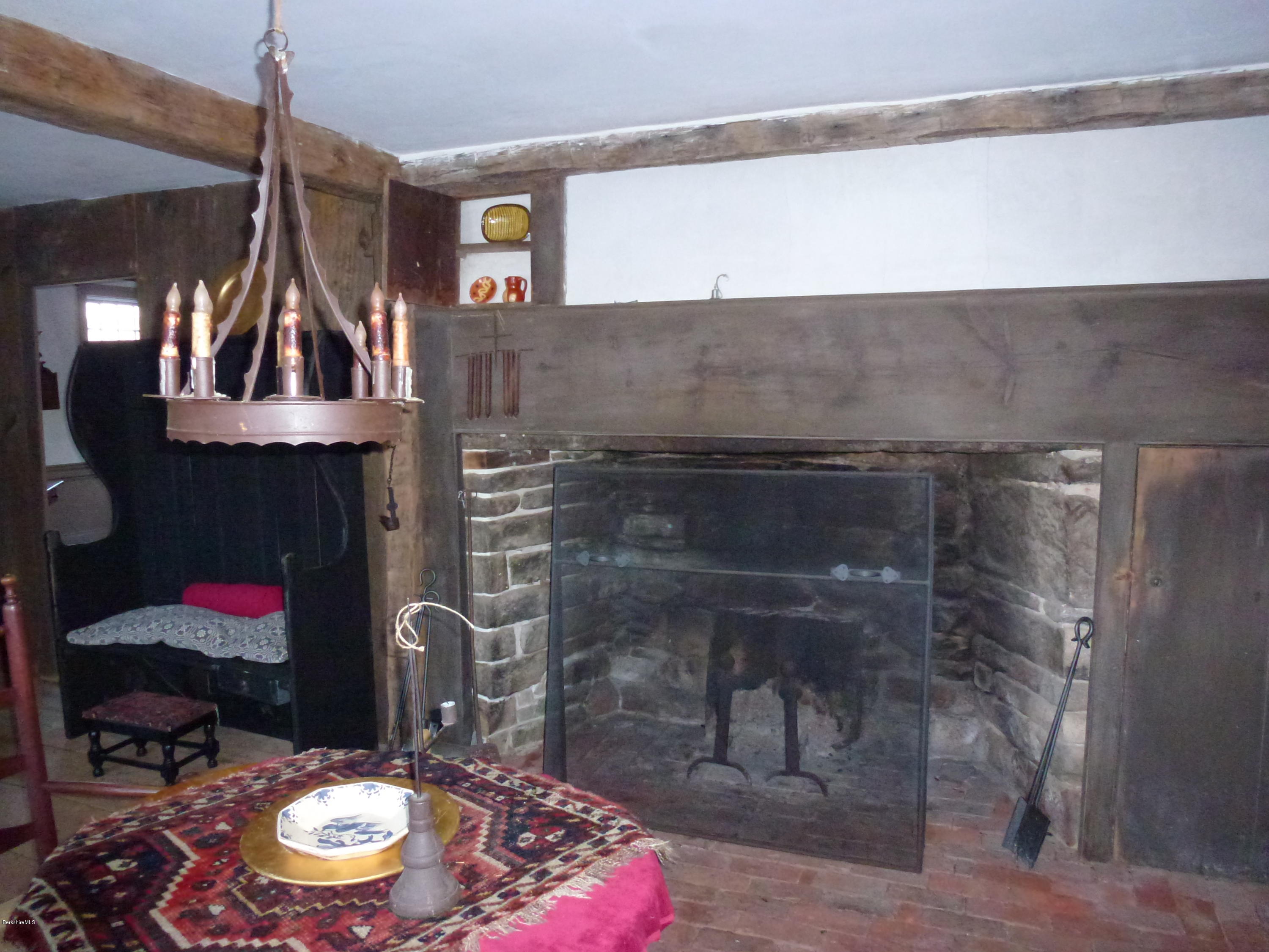 1600 Russell Road Montgomery, MA 01085 - Photo 12 of 36 a room with fireplace and chairs