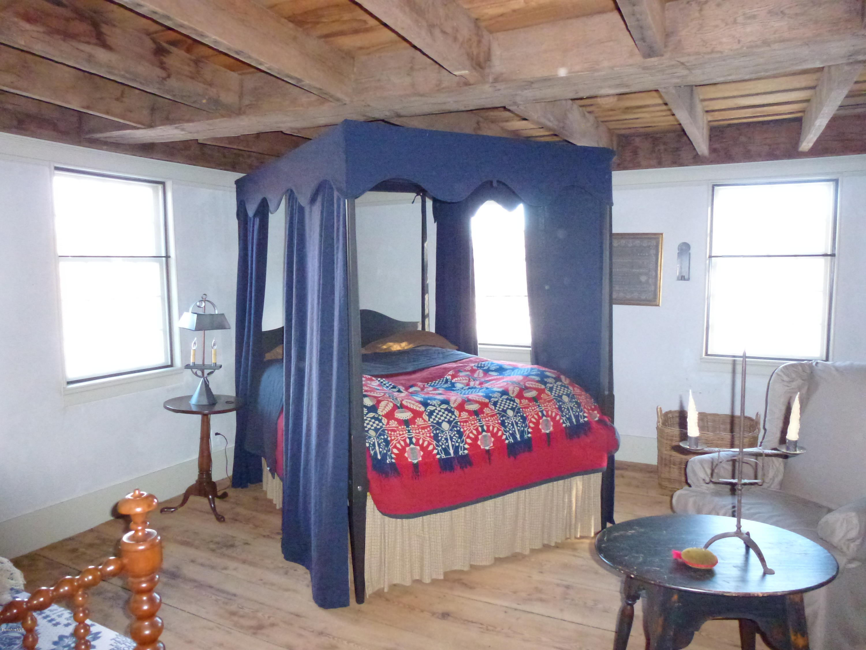 1600 Russell Road Montgomery, MA 01085 - Photo 18 of 36 a bedroom with a bed and a table