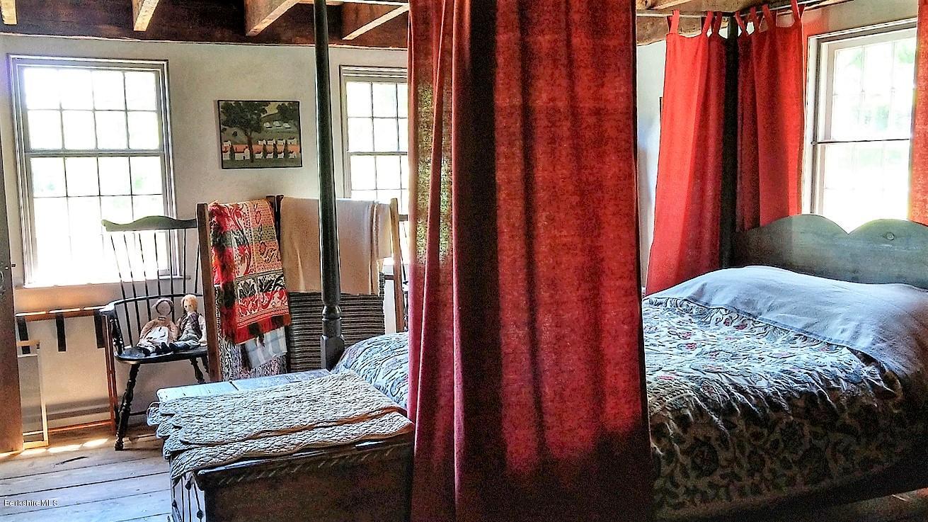 1600 Russell Road Montgomery, MA 01085 - Photo 21 of 36 a bedroom with a bed and a window