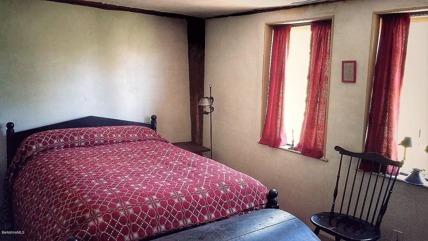 1600 Russell Road Montgomery, MA 01085 - Photo 22 of 36 a bedroom with a bed and a window
