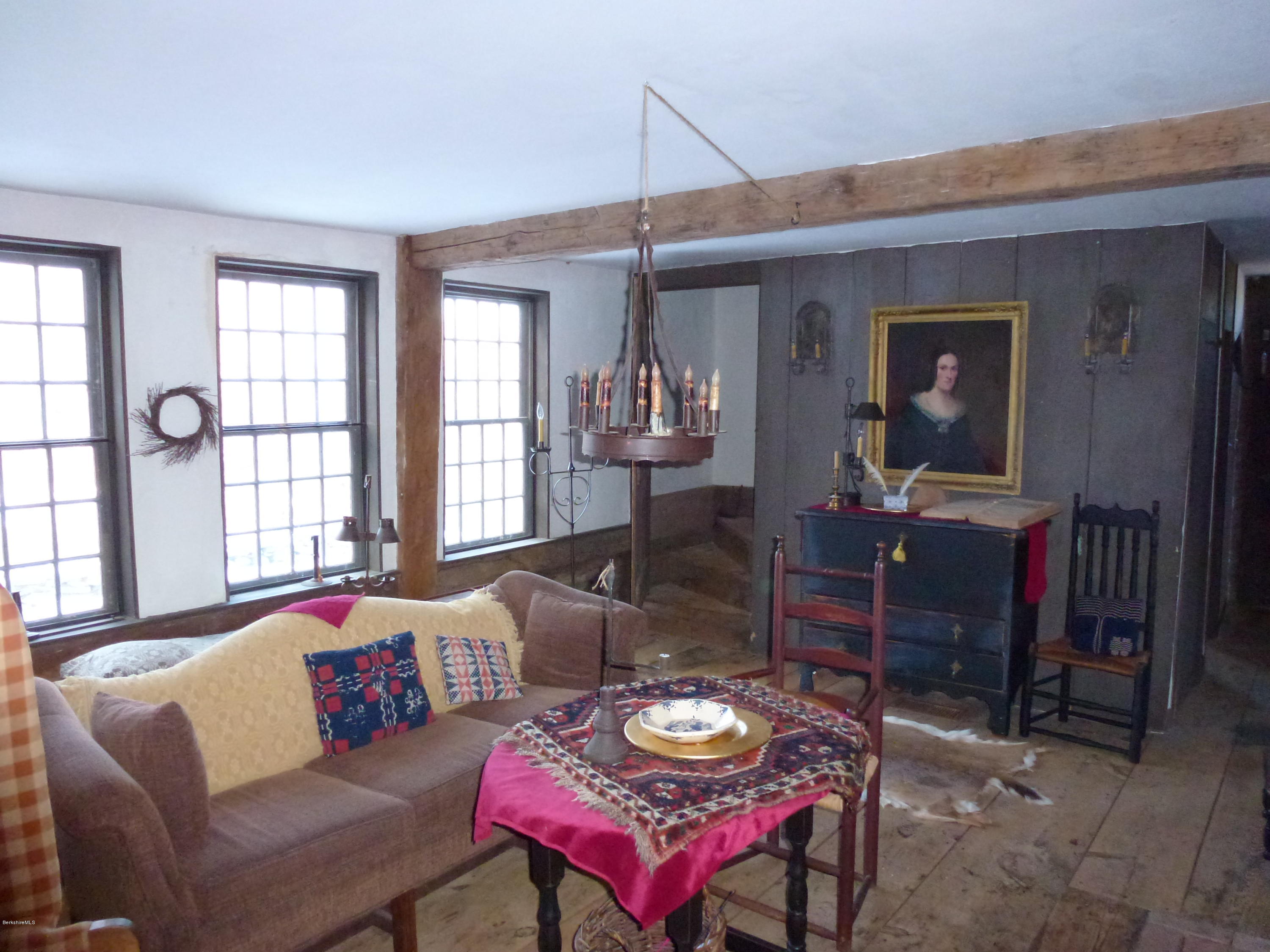 1600 Russell Road Montgomery, MA 01085 - Photo 10 of 36 a living room with furniture a window and a flat screen tv