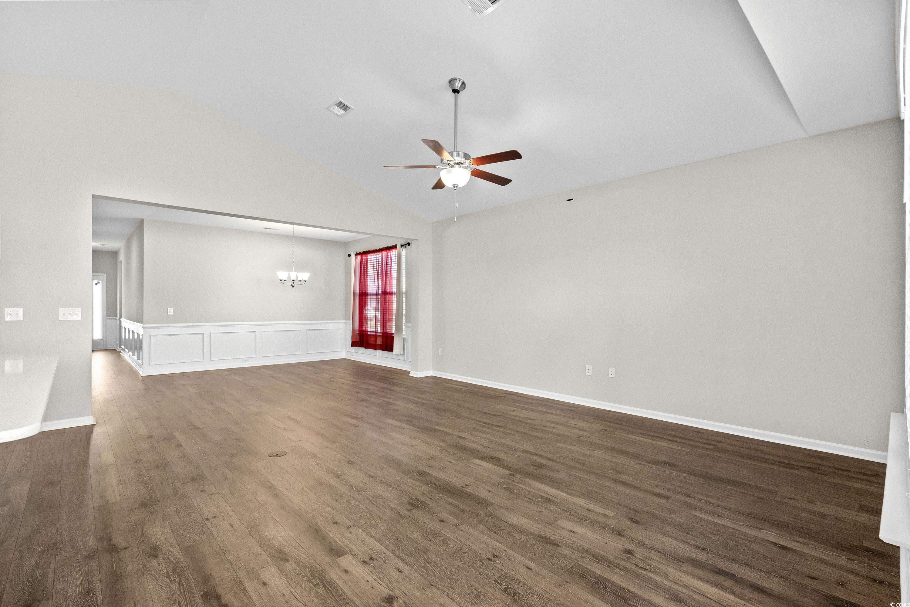 1378 TESSERA Way Myrtle Beach, SC 29579 - Photo 11 of 40 Unfurnished living room featuring ceiling fan with