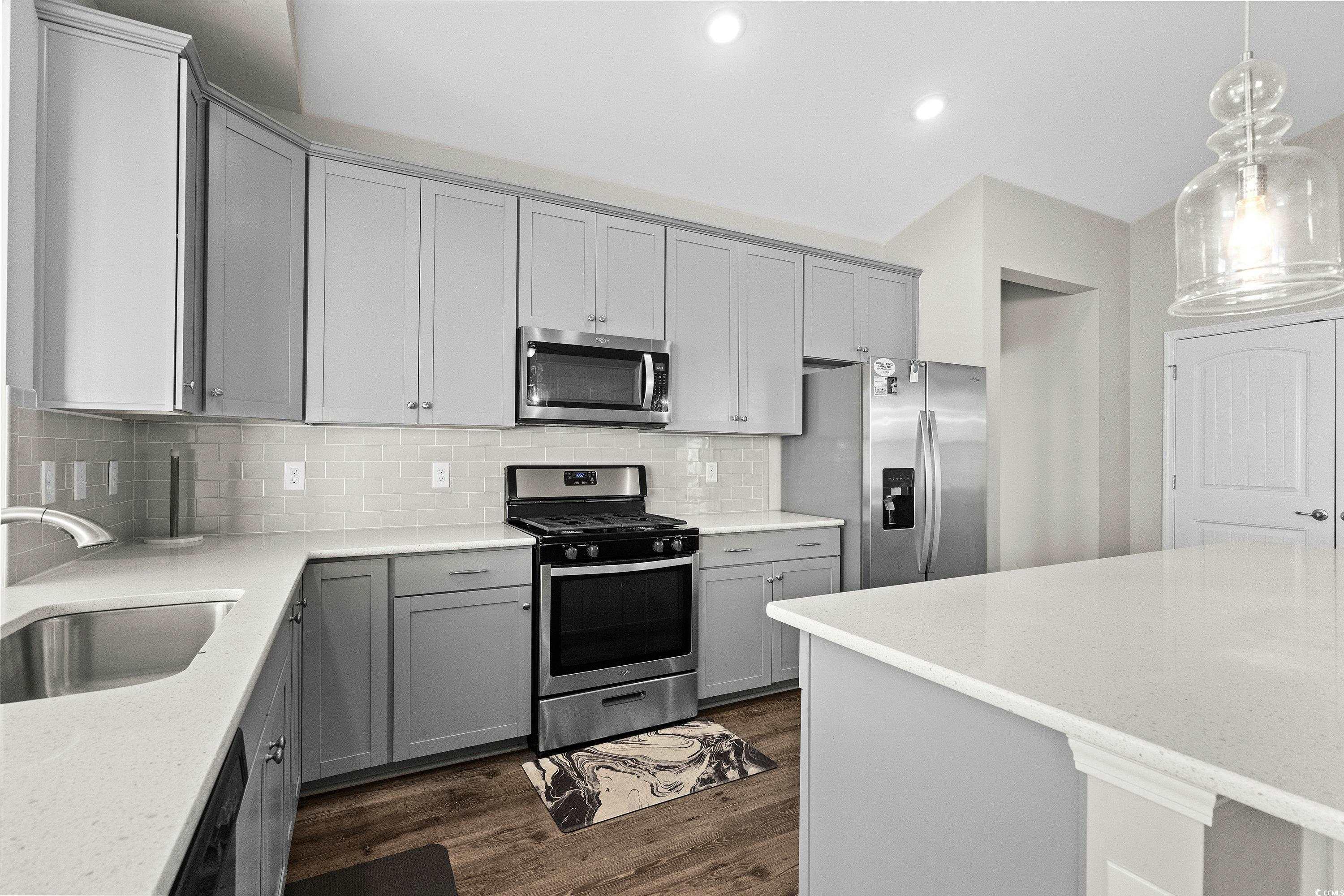 1378 TESSERA Way Myrtle Beach, SC 29579 - Photo 14 of 40 Kitchen with light stone countertops, appliances w
