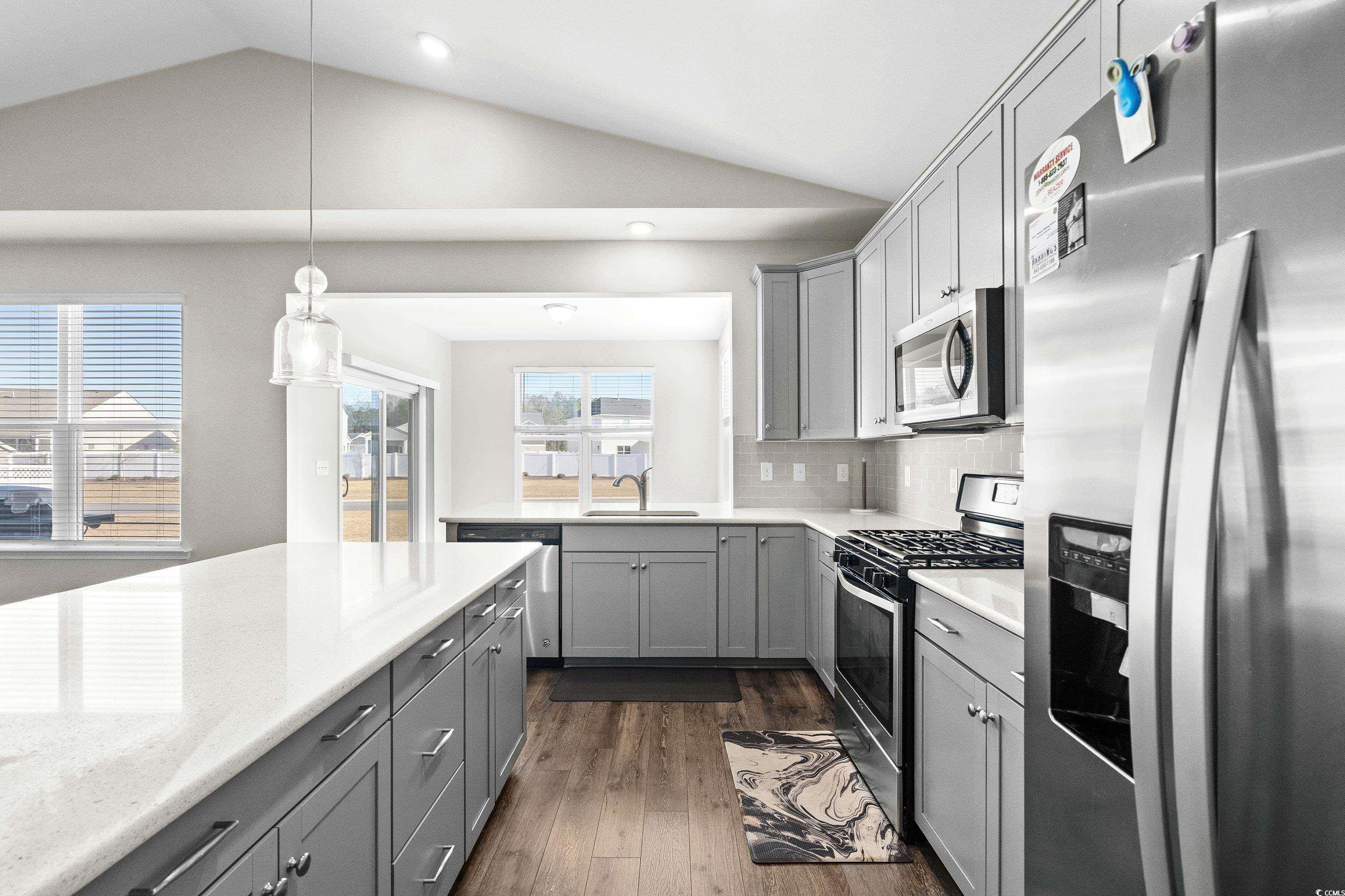 1378 TESSERA Way Myrtle Beach, SC 29579 - Photo 15 of 40 Kitchen featuring decorative backsplash, gray cabi