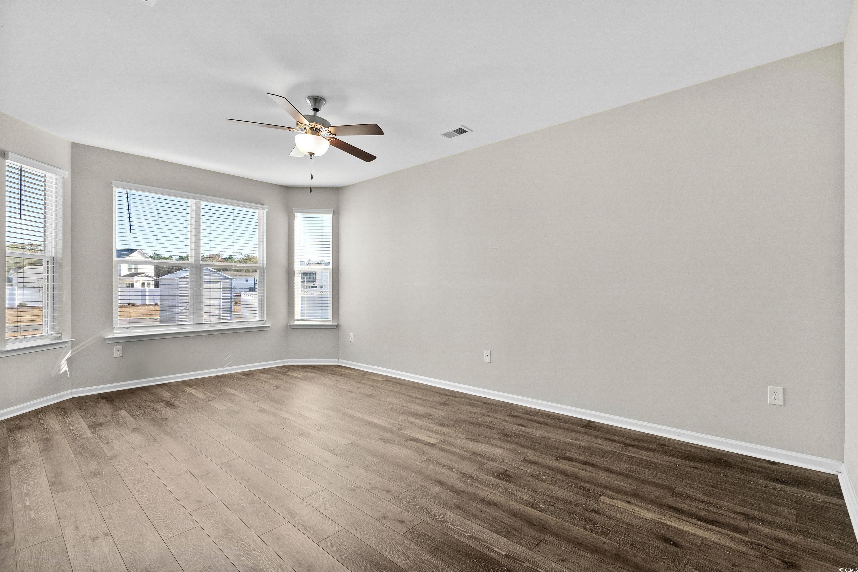 1378 TESSERA Way Myrtle Beach, SC 29579 - Photo 21 of 40 Unfurnished room with wood-type flooring and ceili