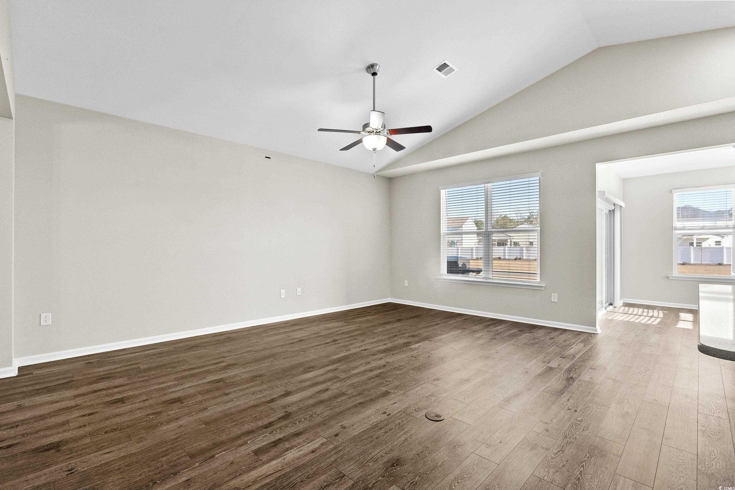 1378 TESSERA Way Myrtle Beach, SC 29579 - Photo 9 of 40 Unfurnished living room with dark hardwood / wood-