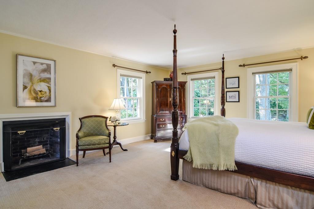 34 Lowell Road Wellesley, MA 02481 - Photo 11 of 14 a living room with furniture and a fireplace