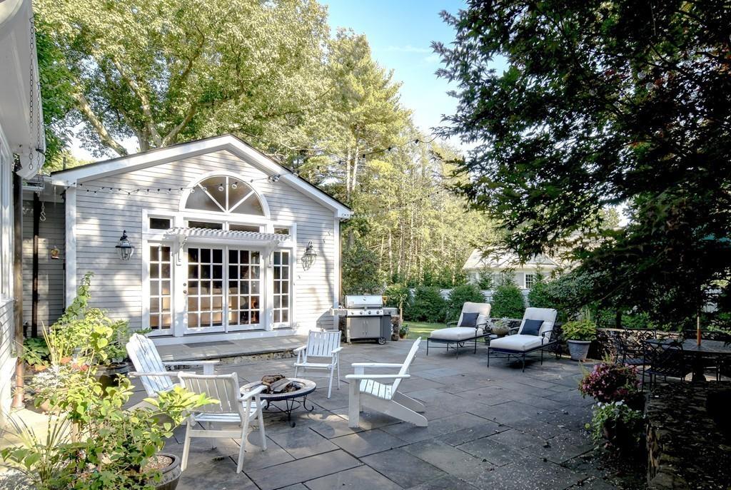 34 Lowell Road Wellesley, MA 02481 - Photo 13 of 14 a front view of a house with garden