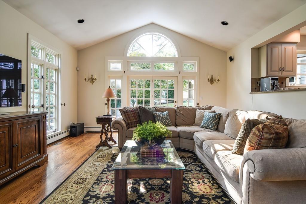34 Lowell Road Wellesley, MA 02481 - Photo 7 of 14 a living room with furniture fireplace and a large window
