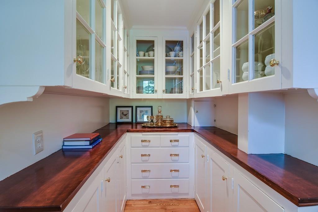 34 Lowell Road Wellesley, MA 02481 - Photo 8 of 14 a kitchen with stainless steel appliances a cabinets and window