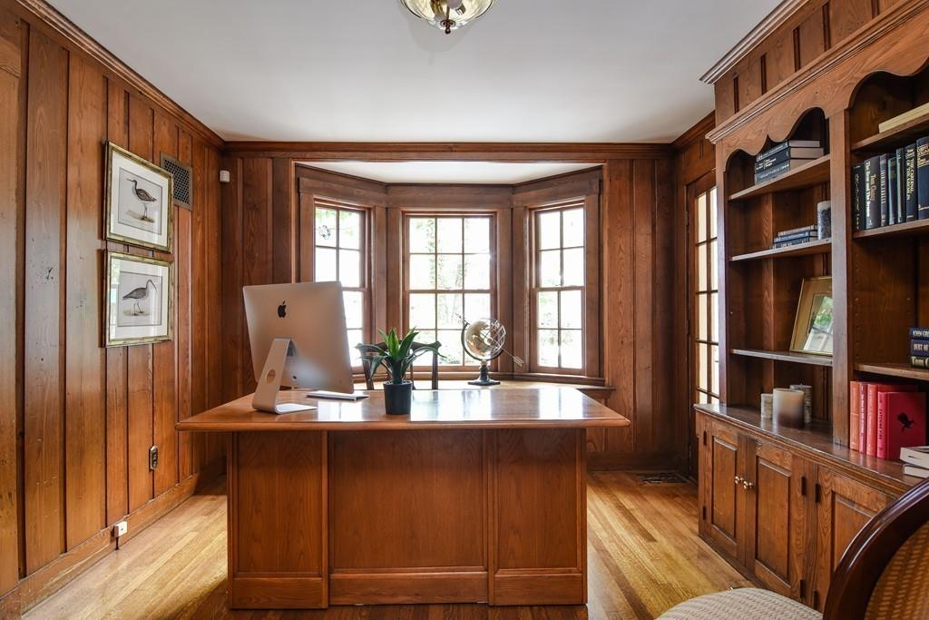 34 Lowell Road Wellesley, MA 02481 - Photo 10 of 14 a living room with furniture and a book shelf