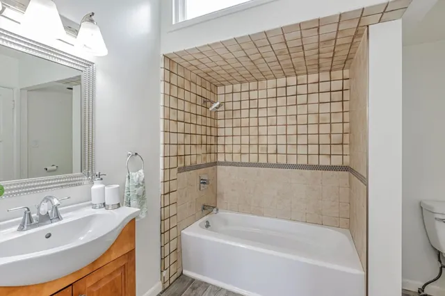 a bathroom with a bathtub and a sink