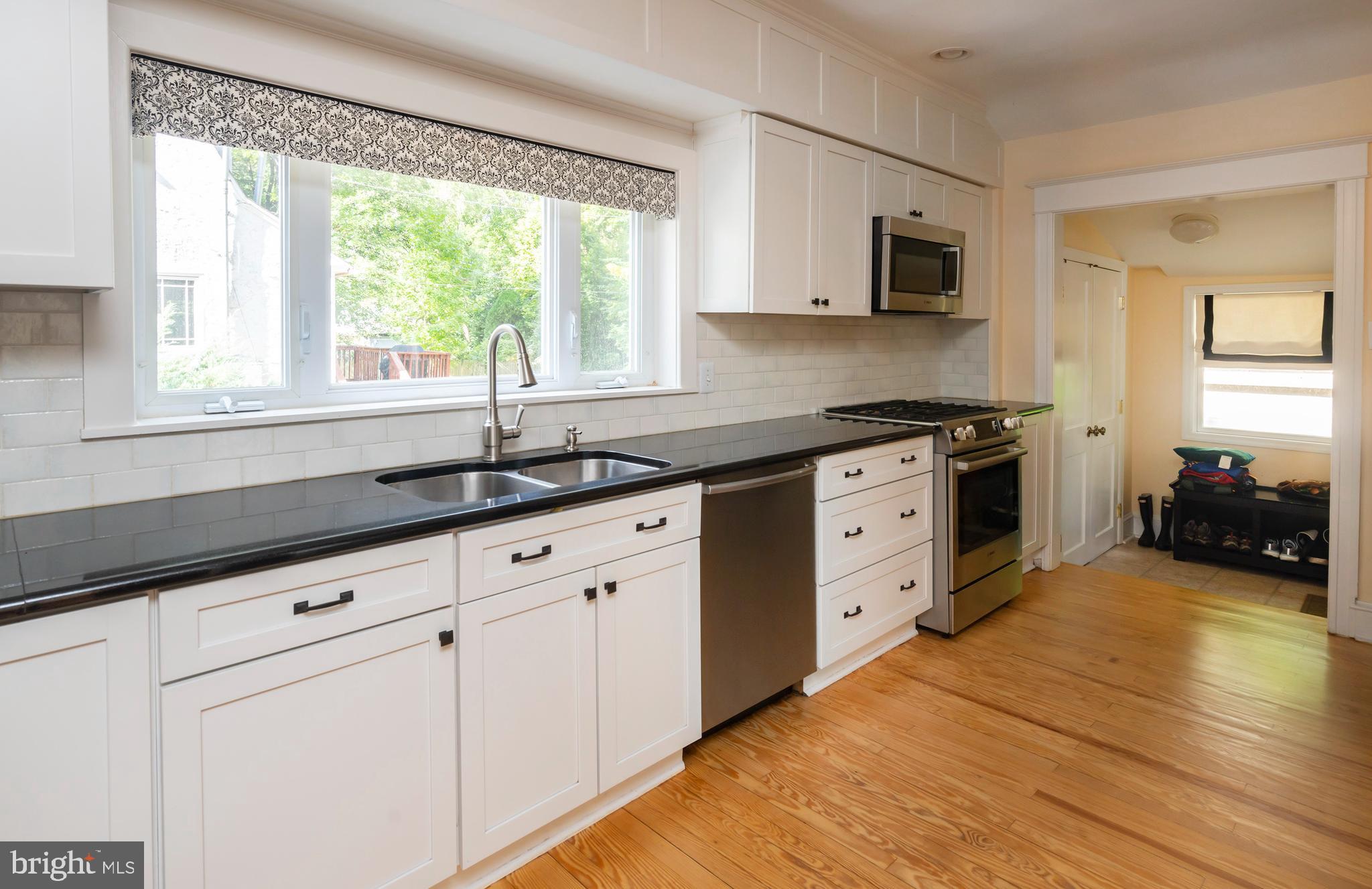 327 Valley Road Merion Station, PA 19066 - Photo 17 of 55 Kitchen flows to mudroom, coat closet & back patio