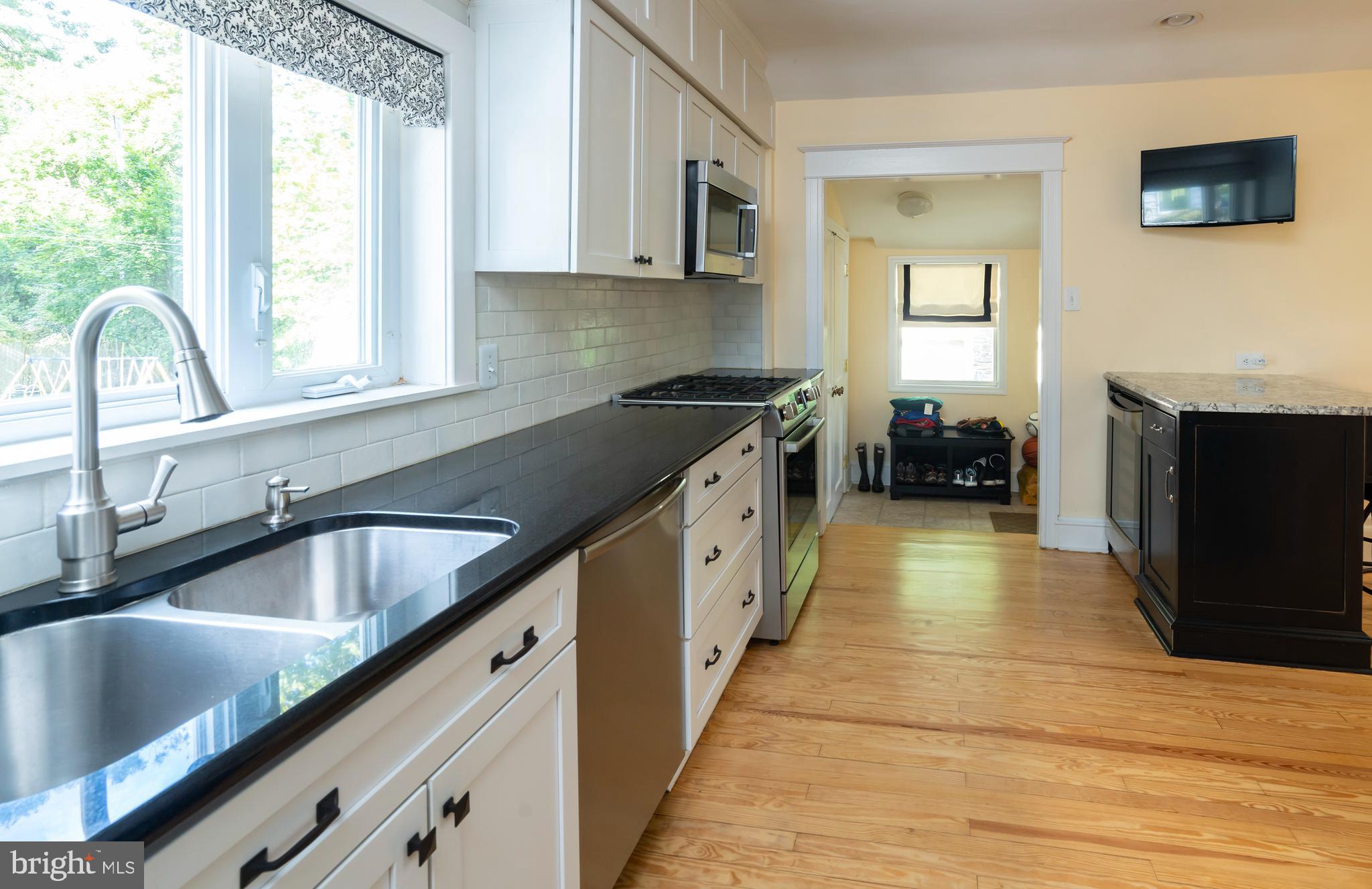 327 Valley Road Merion Station, PA 19066 - Photo 18 of 55 Kitchen flows to mudroom, coat closet & back patio