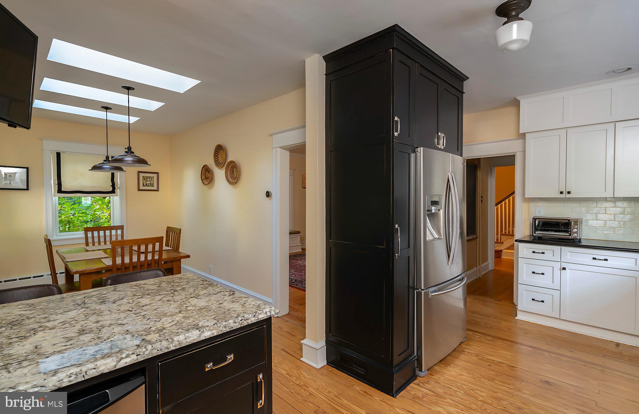 327 Valley Road Merion Station, PA 19066 - Photo 21 of 55 Kitchen flows to dining room and second staircase
