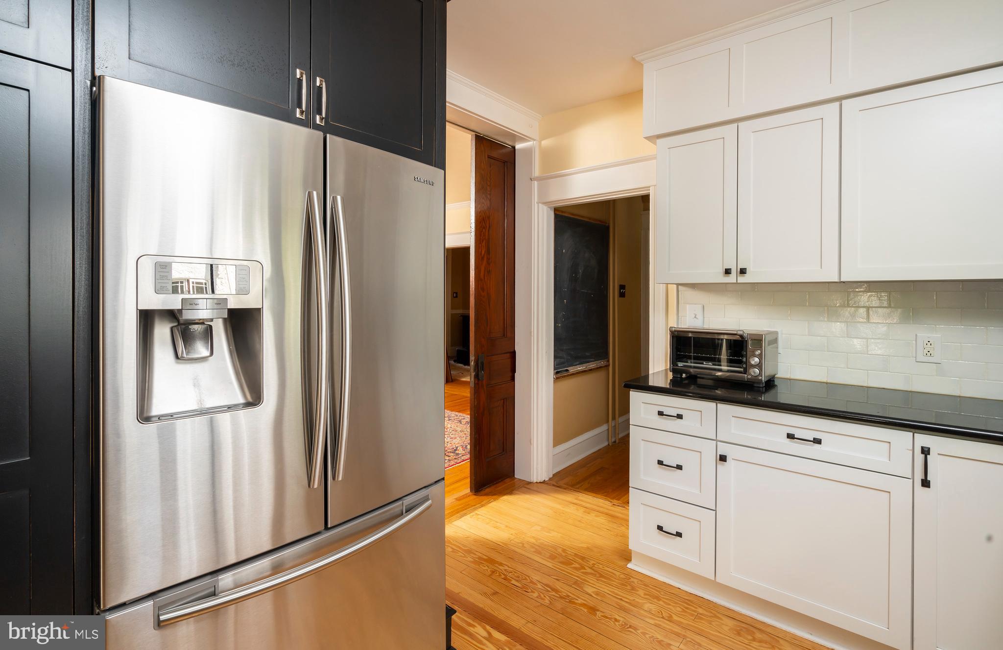 327 Valley Road Merion Station, PA 19066 - Photo 22 of 55 Kitchen flows to dining room and second staircase