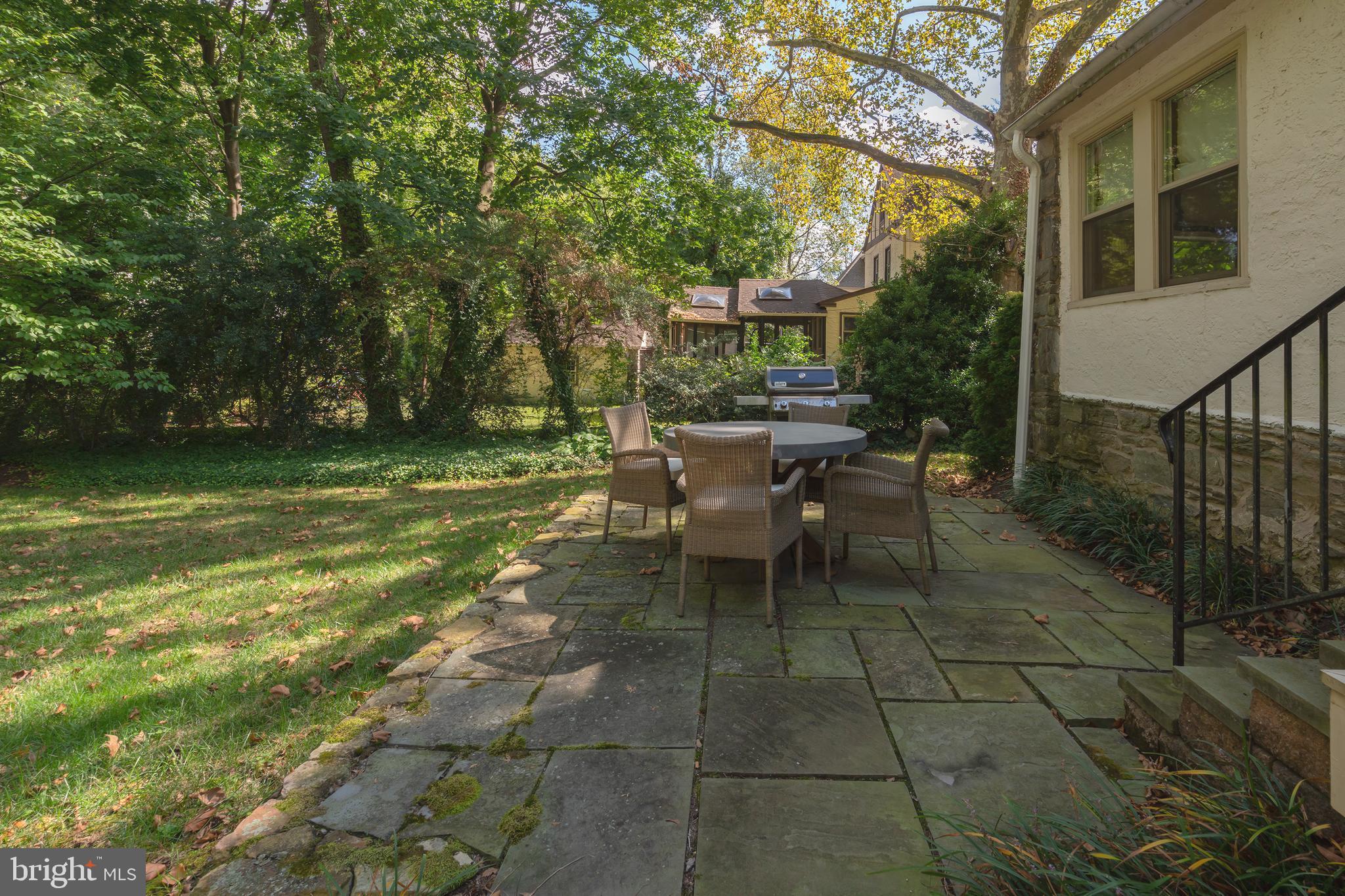327 Valley Road Merion Station, PA 19066 - Photo 53 of 55 Back patio surrounded by mature landscaping