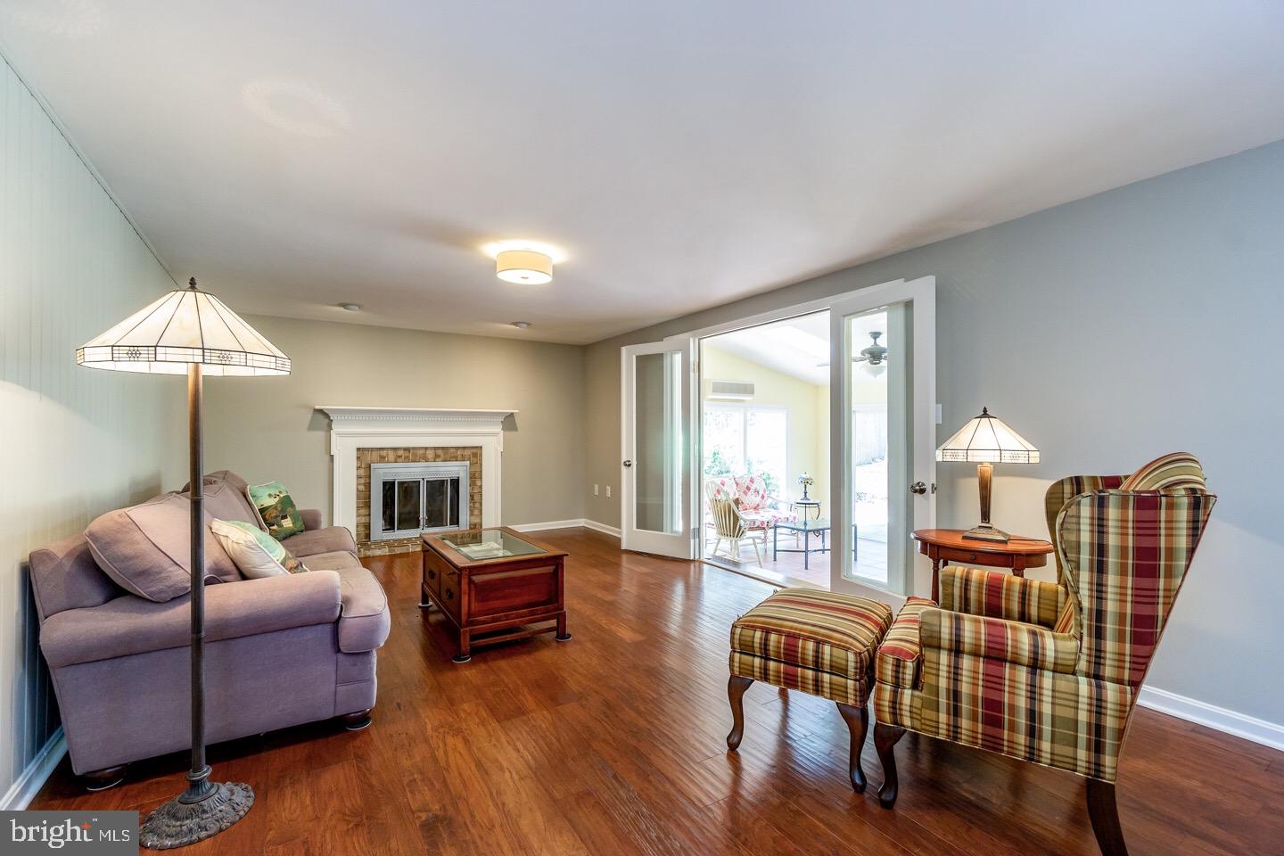 11416 Running Cedar Road Reston, VA 20191 - Photo 19 of 43 FAMILY ROOM WITH NEW HWD FLOORS + WOOD BURNING FP
