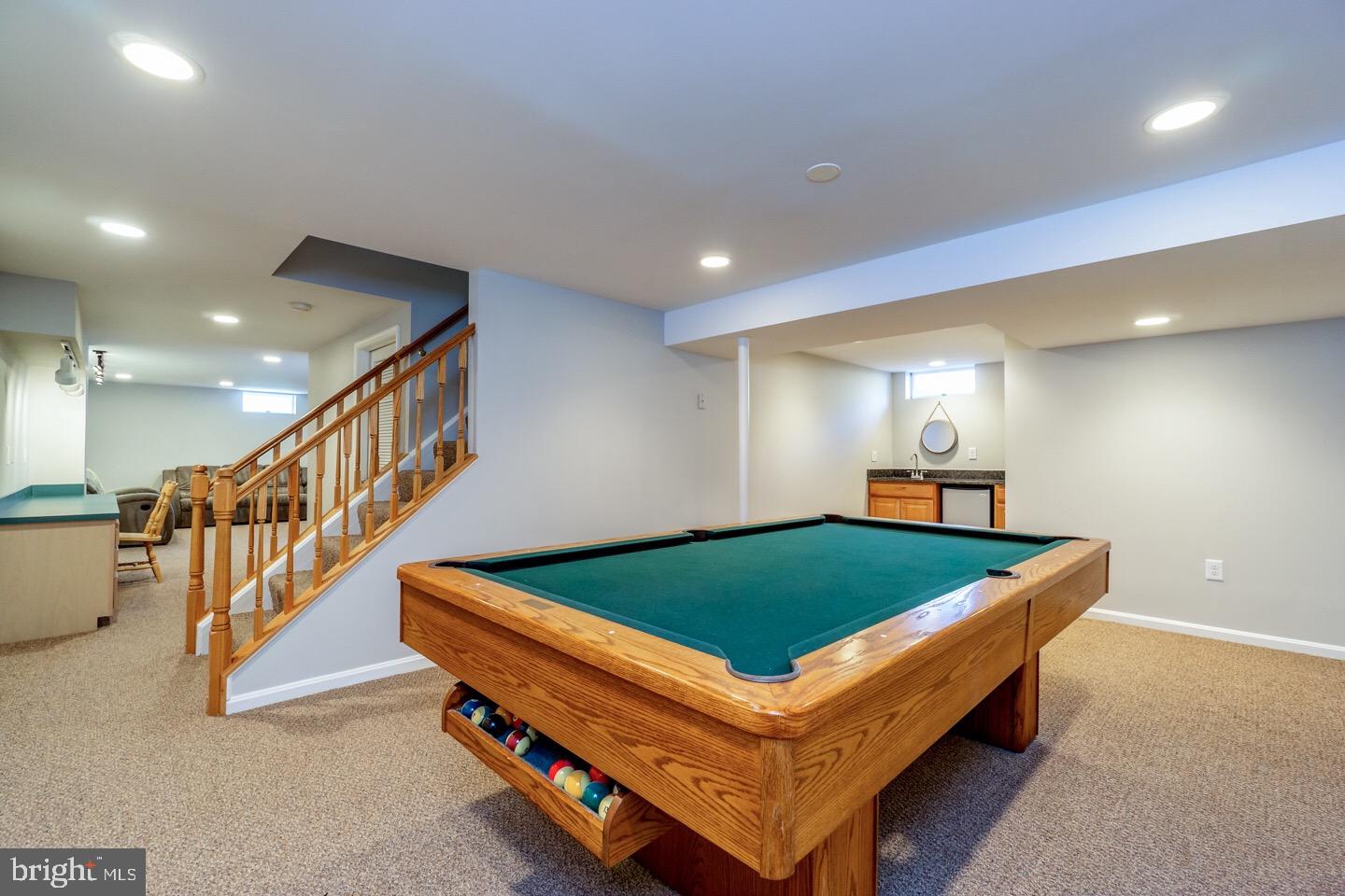 11416 Running Cedar Road Reston, VA 20191 - Photo 37 of 43 FINISHED BASEMENT OFFERS LARGE REC ROOM + WET BAR