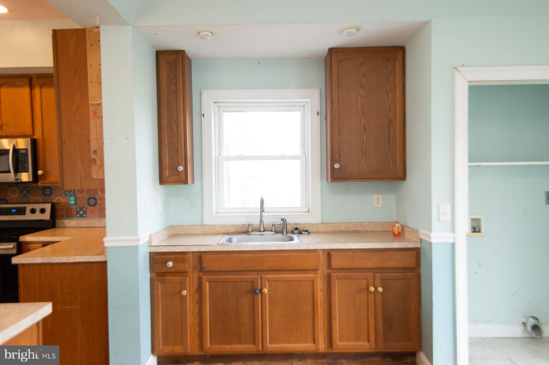 1210 Stone Boundary Road Cambridge, MD 21613 - Photo 29 of 63 a bathroom with a sink and a mirror