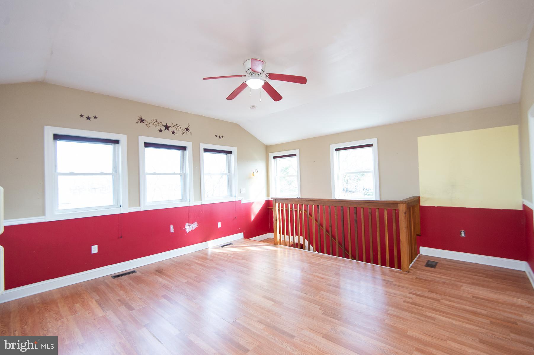 1210 Stone Boundary Road Cambridge, MD 21613 - Photo 30 of 63 a living room with furniture and wooden floor