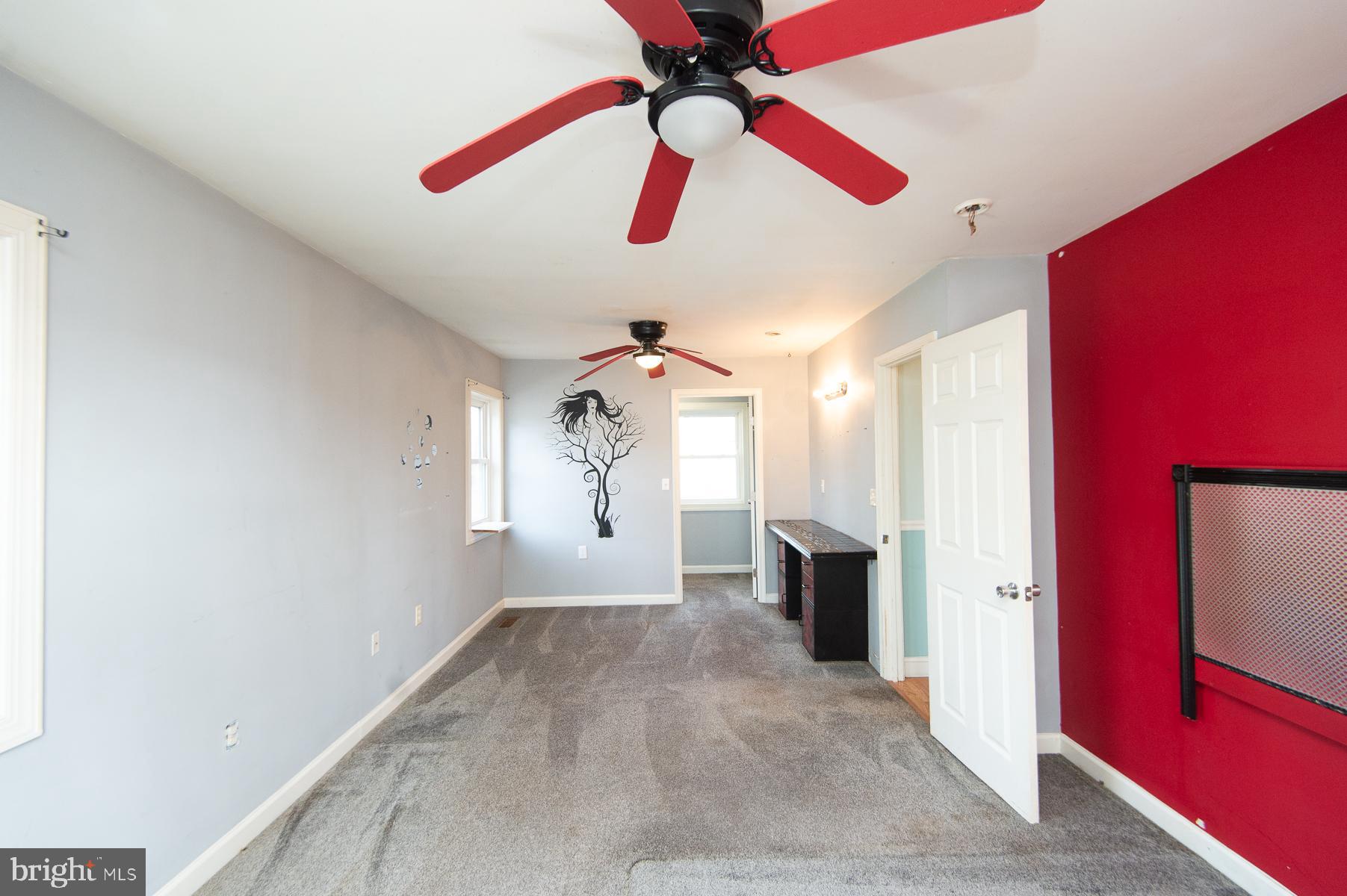 1210 Stone Boundary Road Cambridge, MD 21613 - Photo 37 of 63 a view of a room with a ceiling fan and a window