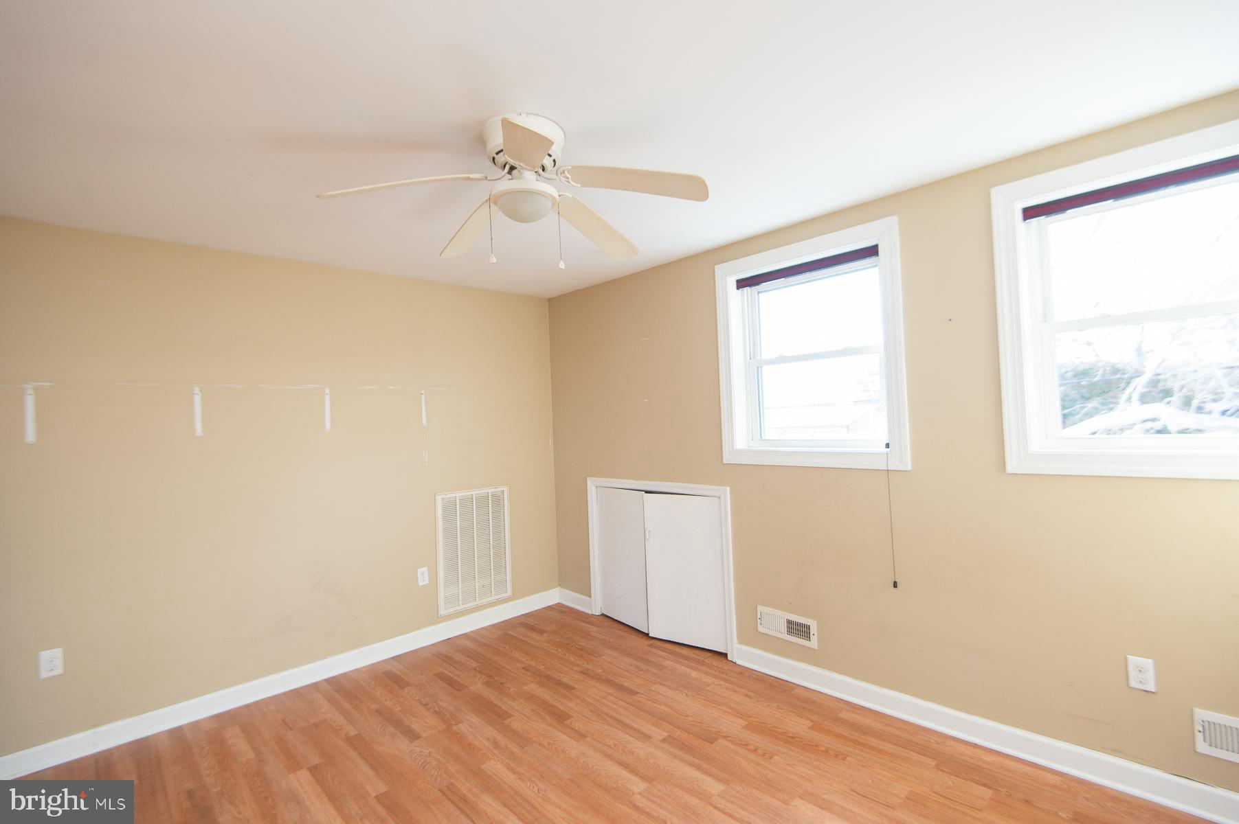 1210 Stone Boundary Road Cambridge, MD 21613 - Photo 41 of 63 a view of an empty room with window and wooden floor